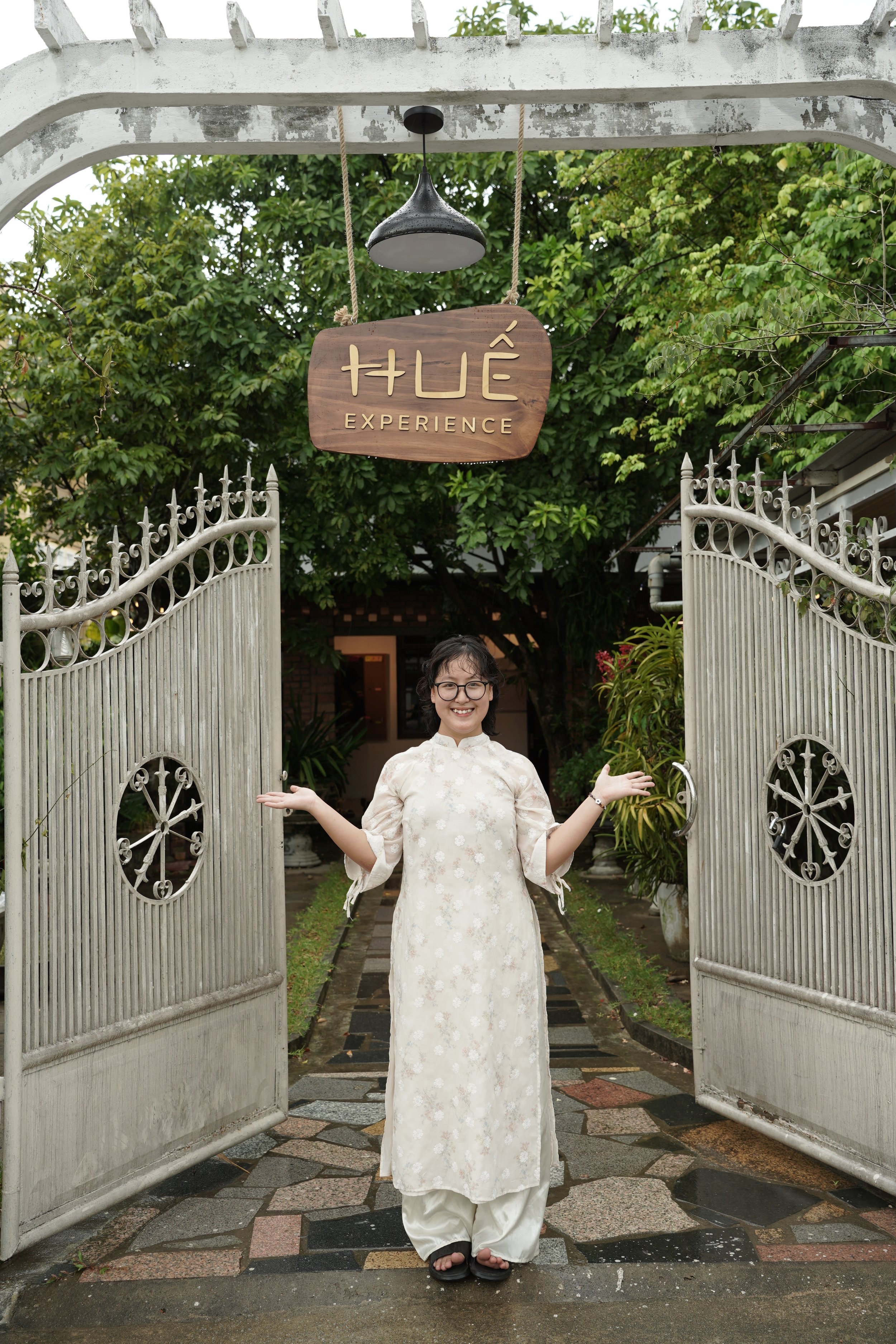 A Hue Experience host welcoming guests at the entrance